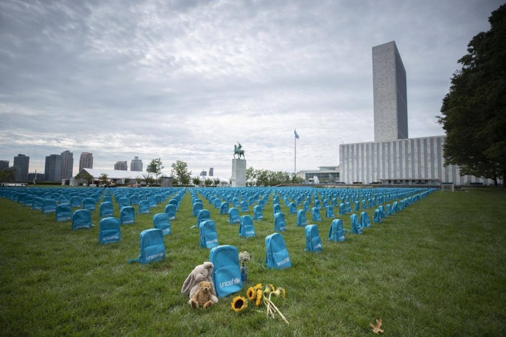 Each blue school bag represents a child killed by conflict in the past year